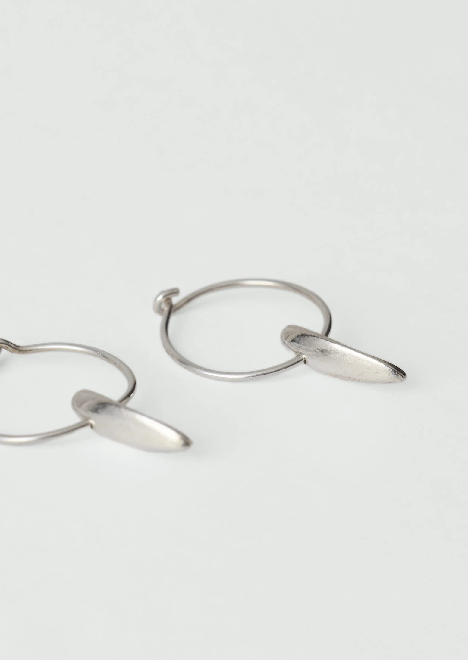 Sally Lacock Sculpted Seed Charm Hoops | Silver - Image 4